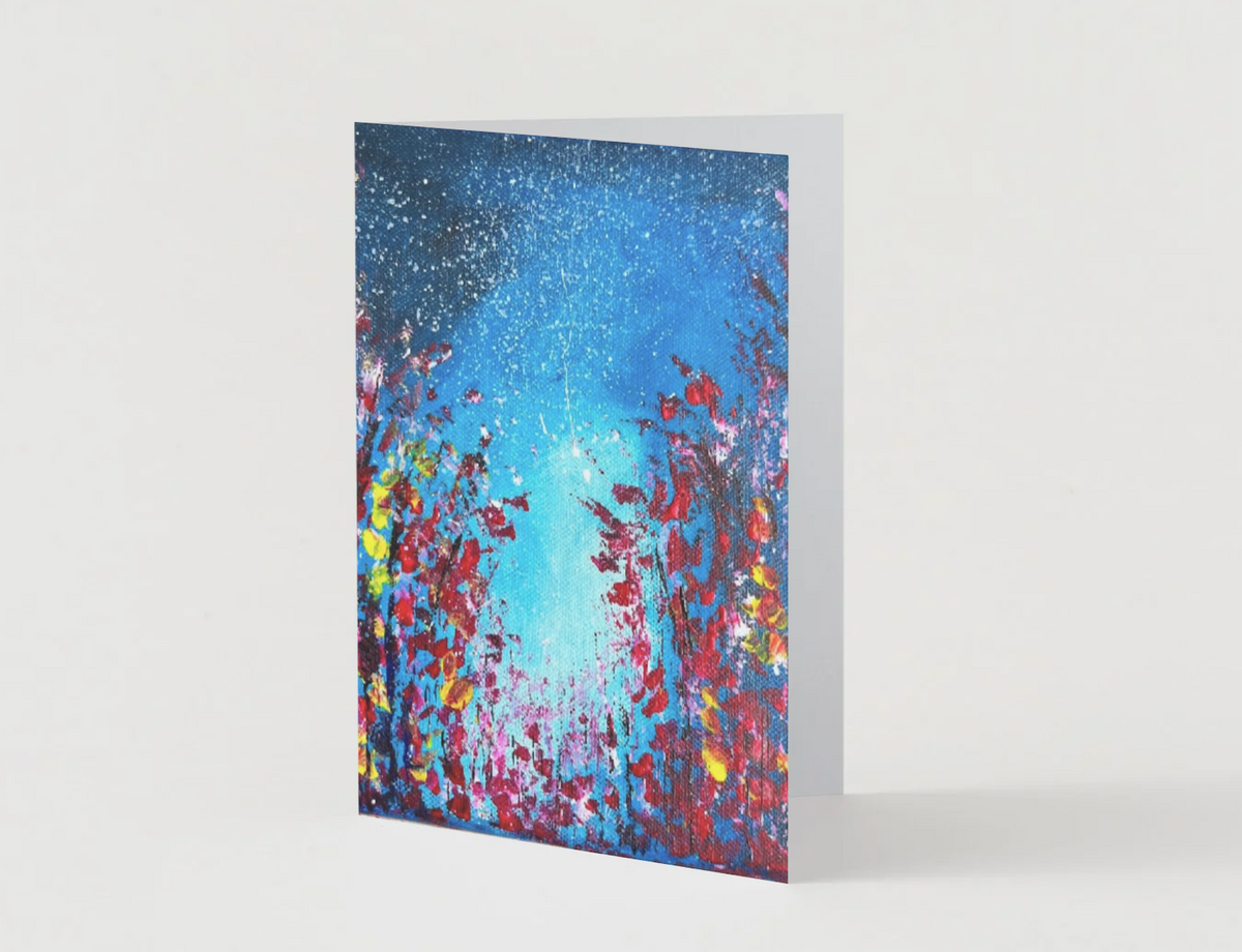 A6 folded greeting card featuring a vibrant hand-painted starlight night sky with red and yellow floral silhouettes.