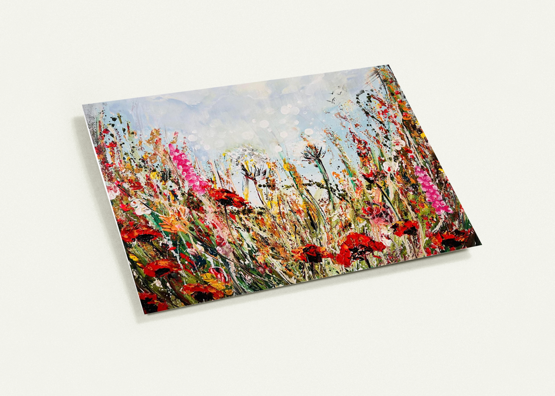 A6 greeting card featuring a vibrant, hand-painted wildflower meadow with red poppies and a satin finish.