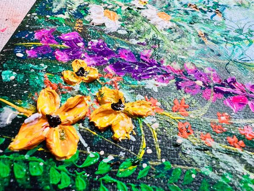 Close-up wildflower artwork with layered paint texture in purple, orange, and teal