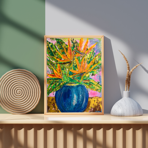 Framed colorful botanical art print with orange and green leaves, blue vase