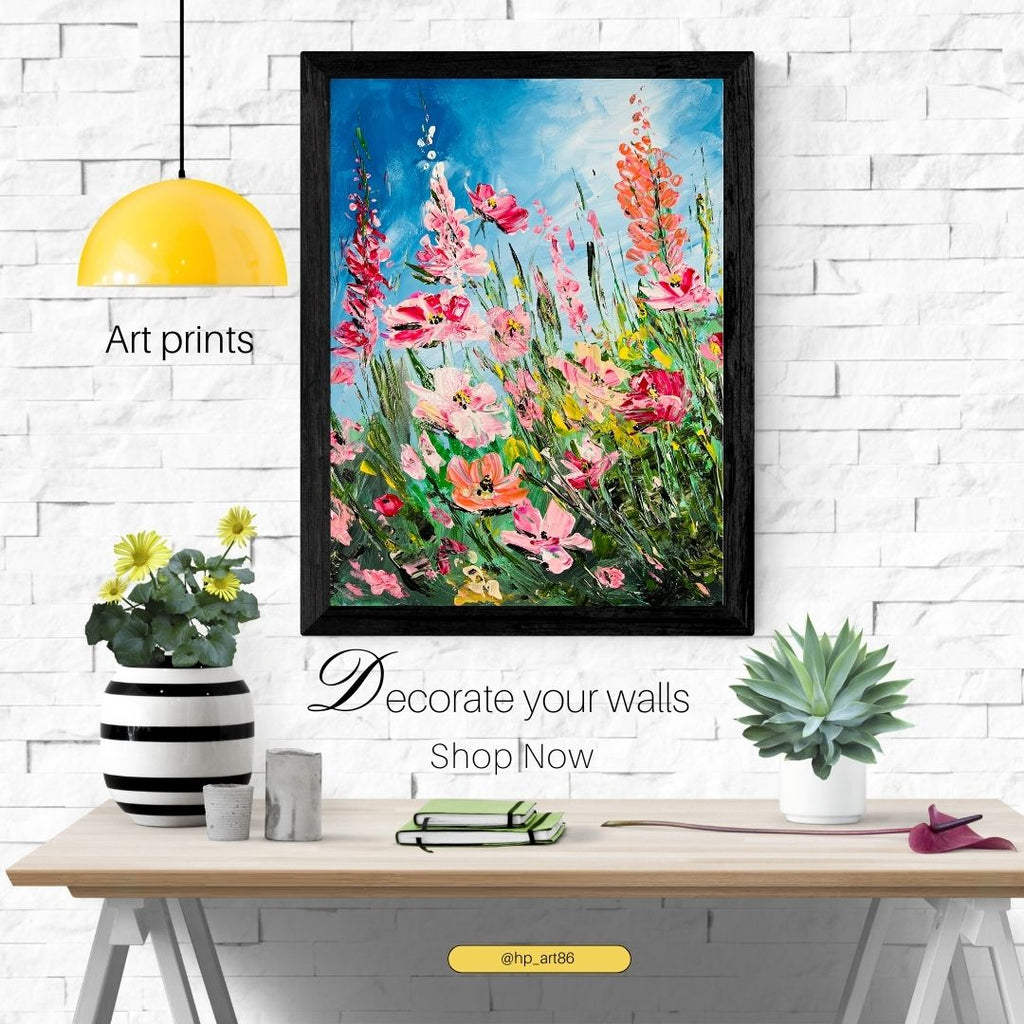 Framed floral art print with vivid pink flowers and green stems, shown in a black frame