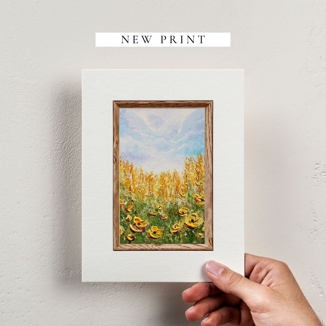 Hand-held framed 3D texture wildflower art print with blue sky and yellow blooms