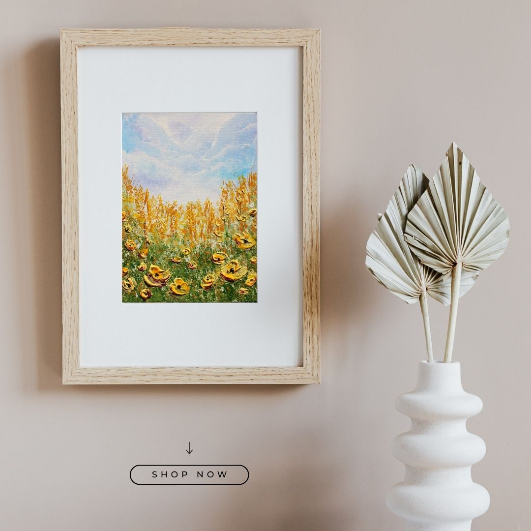 Framed 3D texture wildflower art print with blue sky and yellow blooms, light wood frame