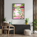 Framed wall art depicting a colorful lily pond with an arched bridge