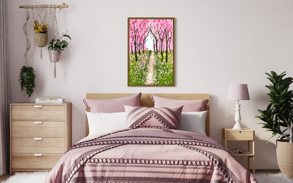 Framed cherry blossom textured painting above bed, showing pink trees and green grass trail