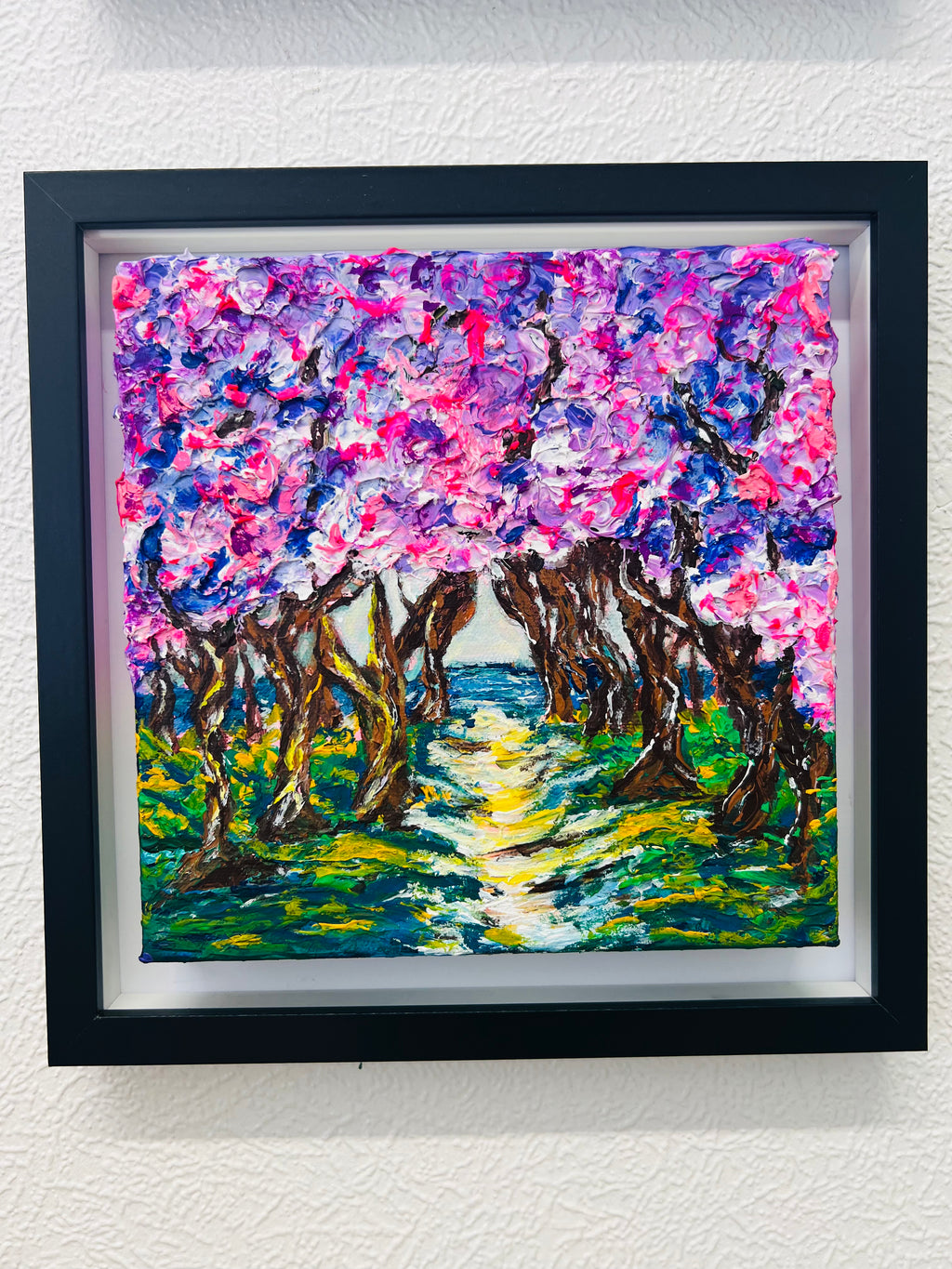 Framed 3D texture artwork with colorful forest path, vivid pink and blue palette