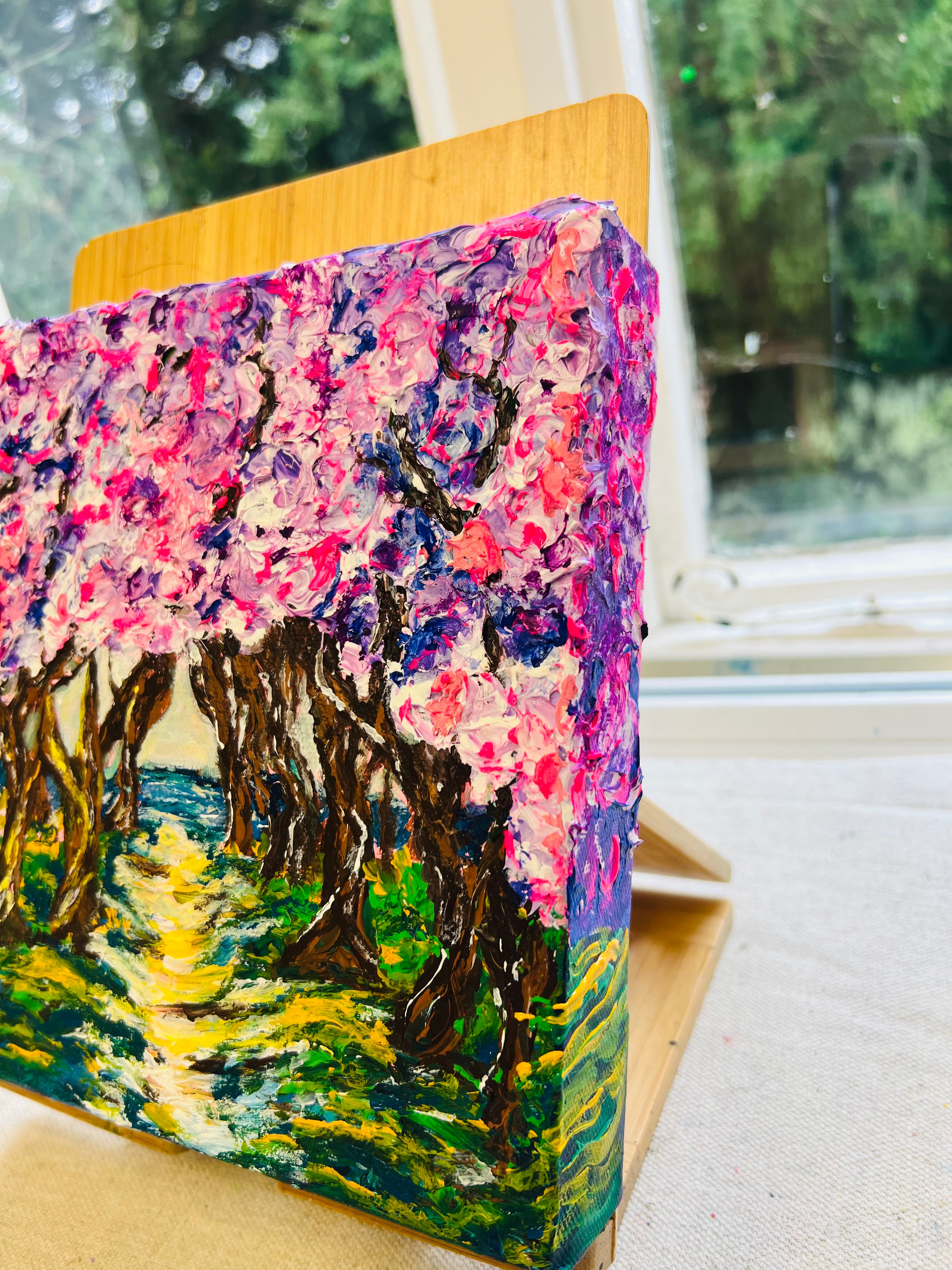 Framed 3D texture artwork in side view on wooden panel, colorful forest scene