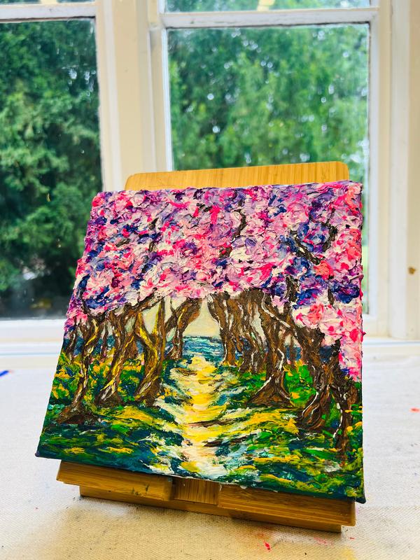 Leaning framed 3D texture artwork showing a bright yellow path through colorful trees
