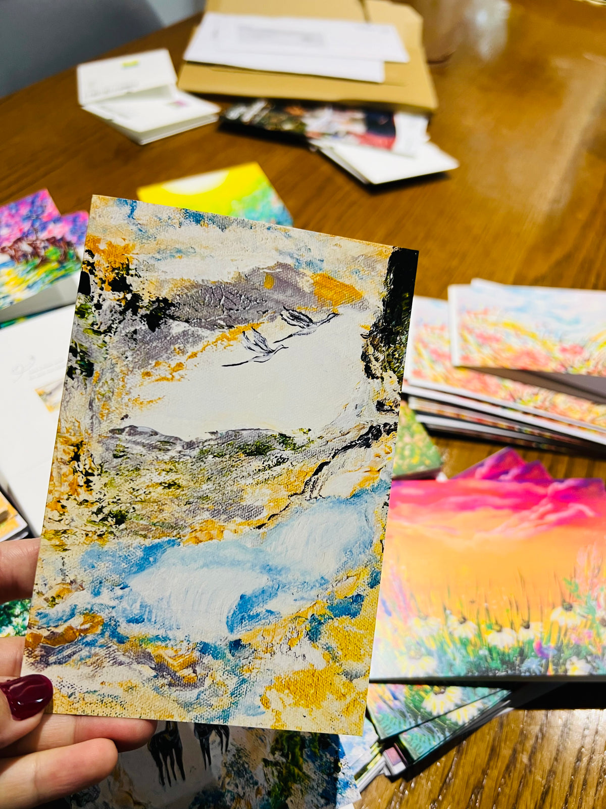 A6 portrait greeting card with an abstract floral painting in blue, yellow, and white on premium 350gsm textured paper.