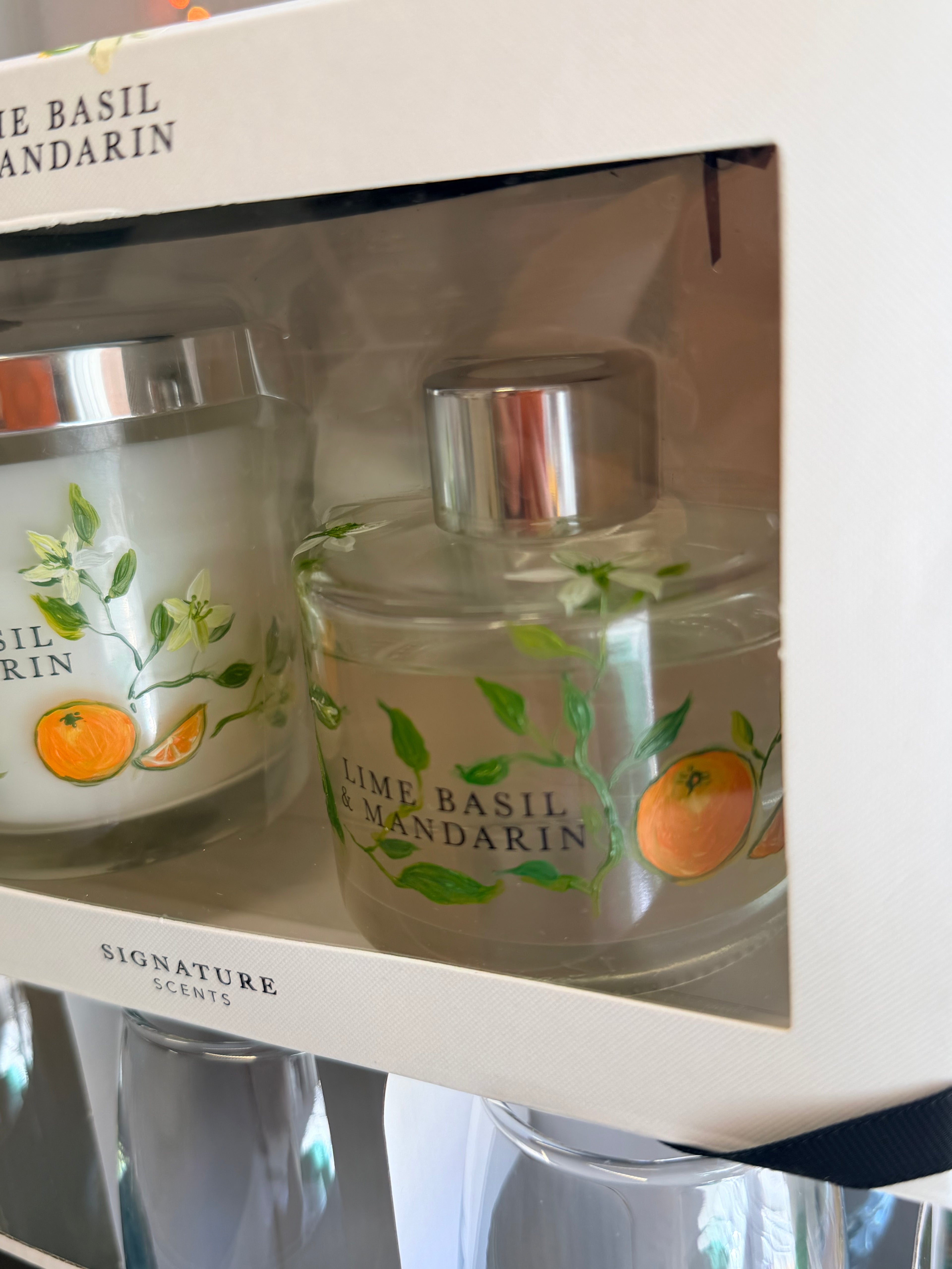 Lime Basil and Mandarin gift set featuring a hand-painted candle and diffuser with citrus fruit and leaf illustrations.