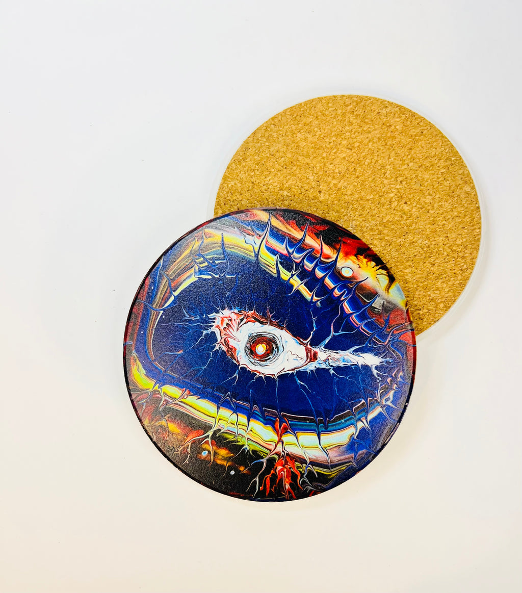 10cm round ceramic coaster featuring a vibrant, hand-painted eye design with a protective cork backing on a white background.