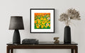 Framed daffodils floral print in black frame with yellow, orange, and white flowers