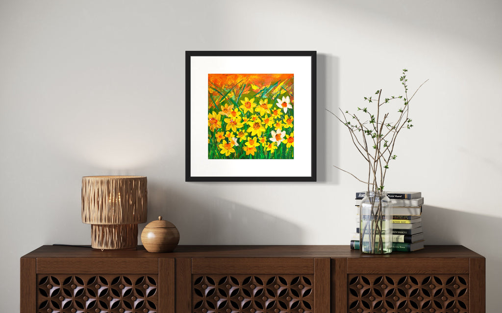 Framed daffodils floral print with vibrant yellow and orange flowers and white accents