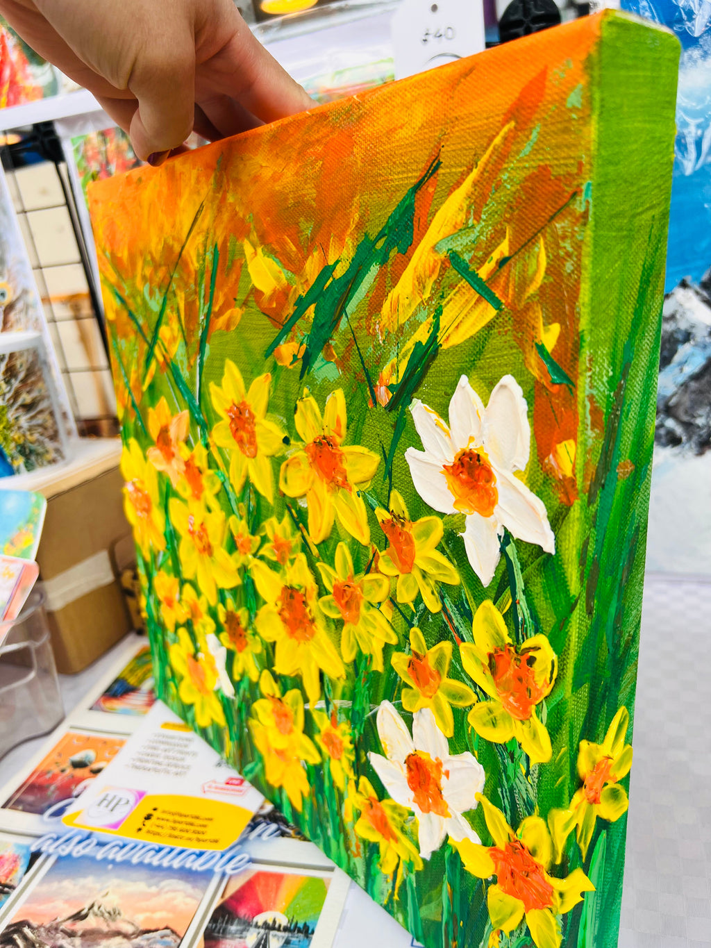 Colorful daffodils artwork canvas with green stems and yellow, orange, and white blooms