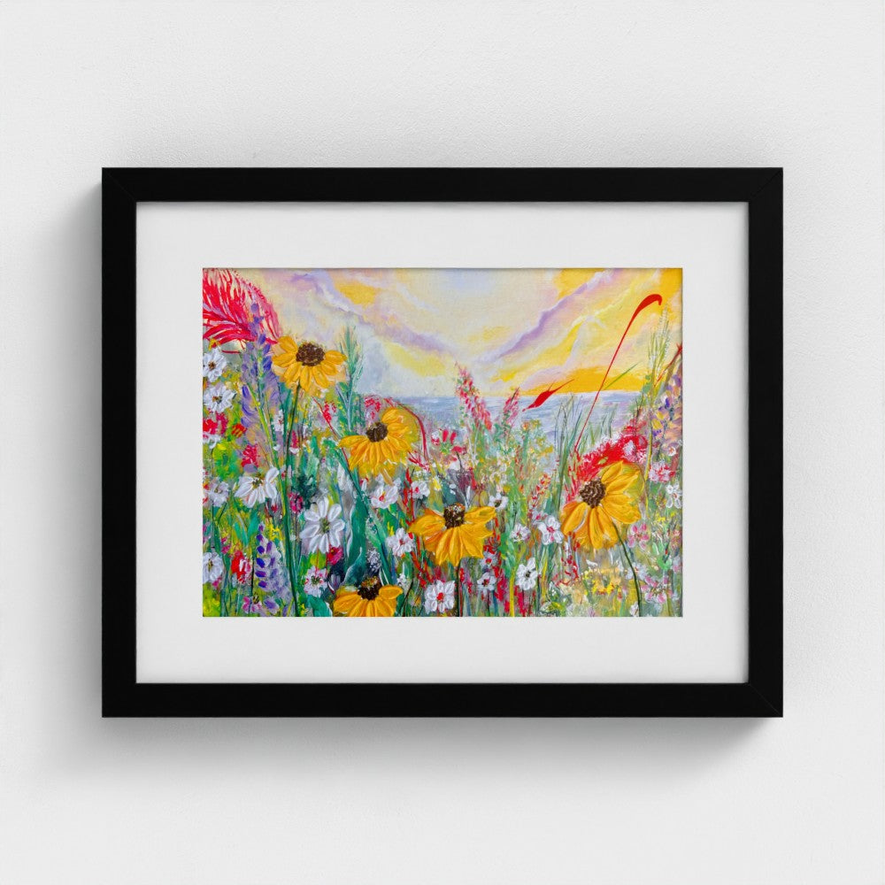Framed mounted print of colorful daisy meadow with black frame