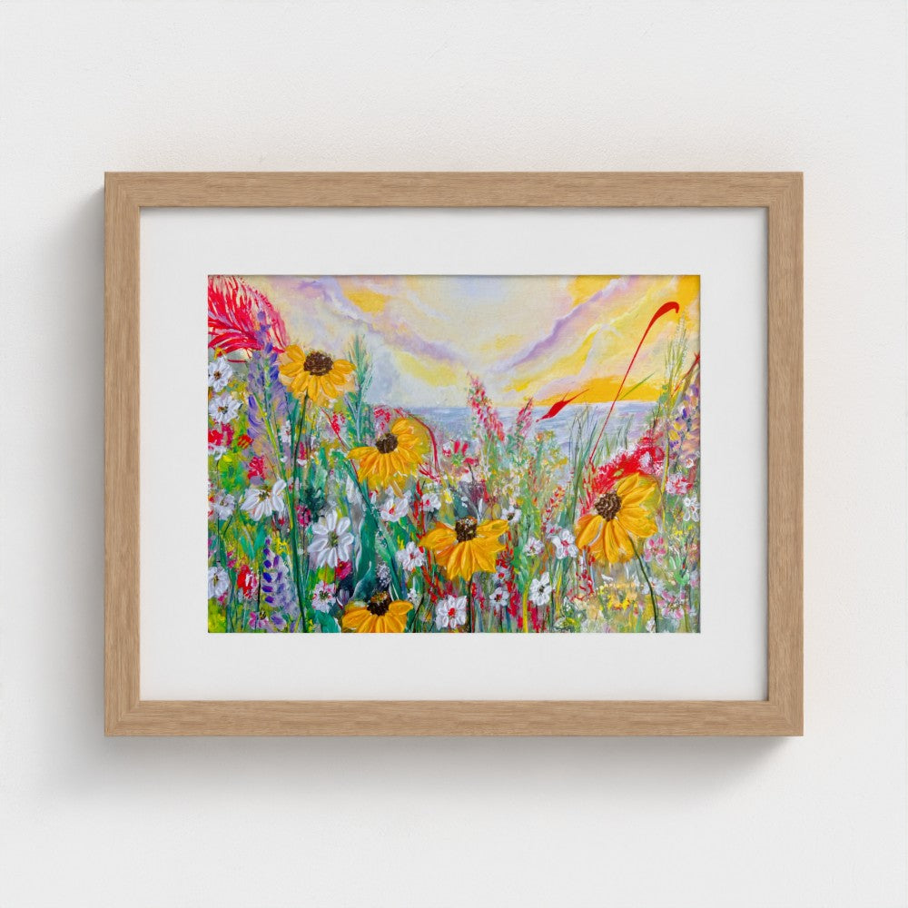Framed mounted print of colorful daisy meadow with natural wood frame