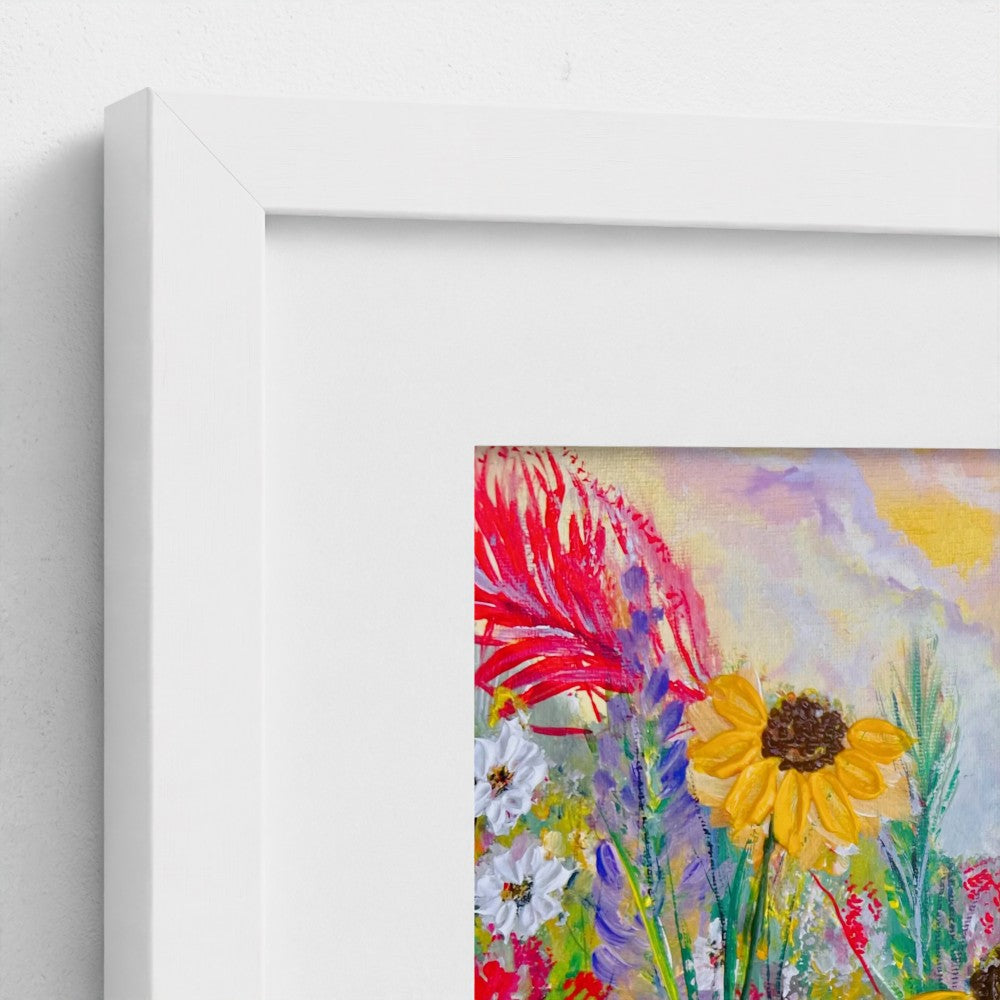 White framed mounted print detail of yellow and red flowers in meadow artwork