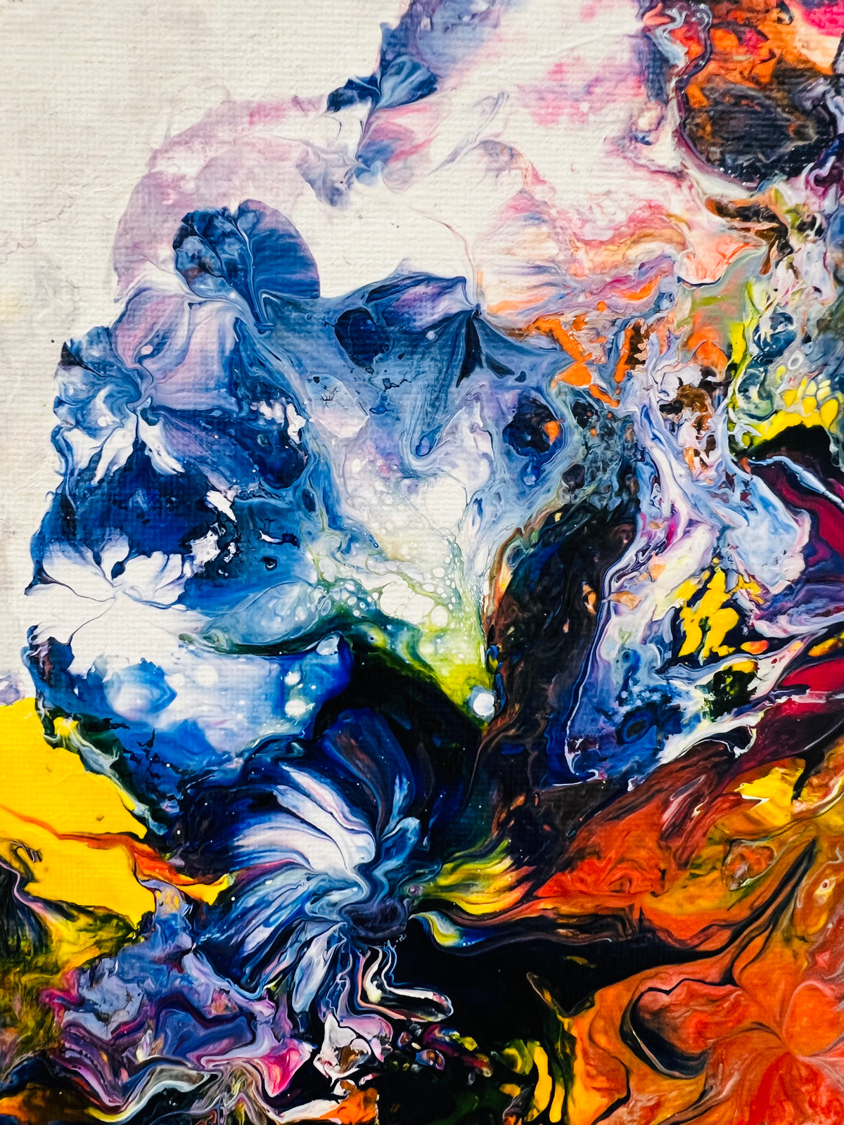 Abstract canvas with layered blue, white, and orange paint clouds and ridged texture