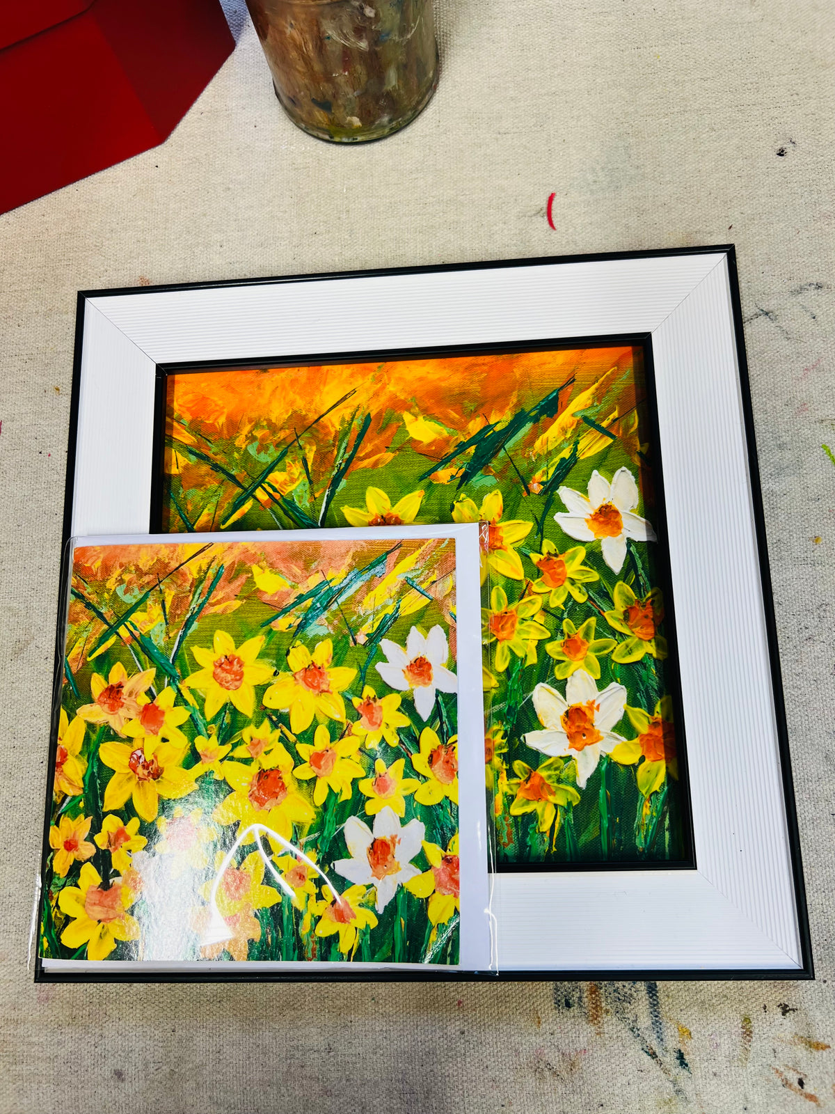 Daffodils gift set featuring a 10x10 inch framed art print and a fine art card with vibrant yellow and white floral painting.