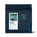 Dark blue coffee bag with ELISABETE MARTINS label, whole bean grind and artwork