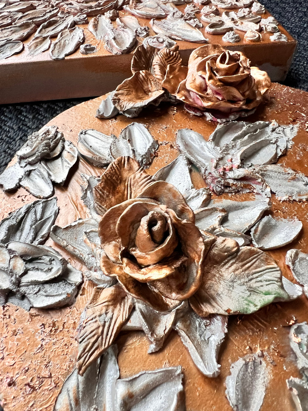 ETERNAL BLISS floral relief plaque with bronze roses and gray leaves on terracotta base