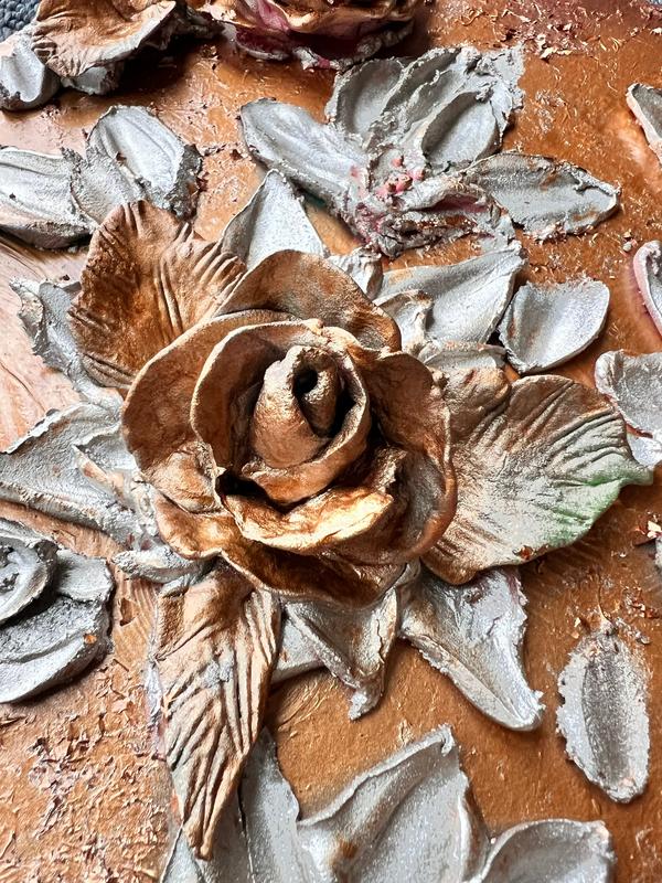 ETERNAL BLISS flower and leaf relief design with bronze rose center on terracotta