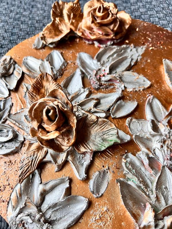 ETERNAL BLISS bronze rose relief with detailed gray petals and leaves on terracotta