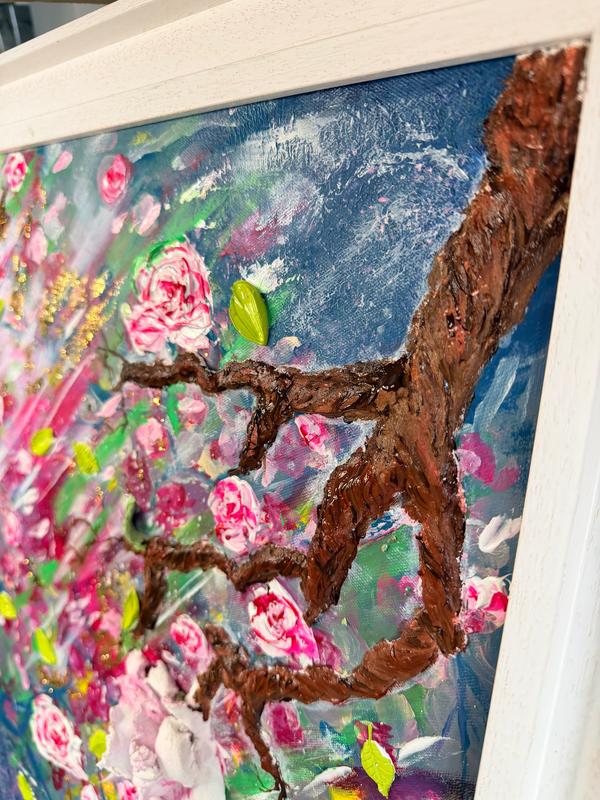 Textured 3D floral painting with pink roses and green leaves in a framed canvas
