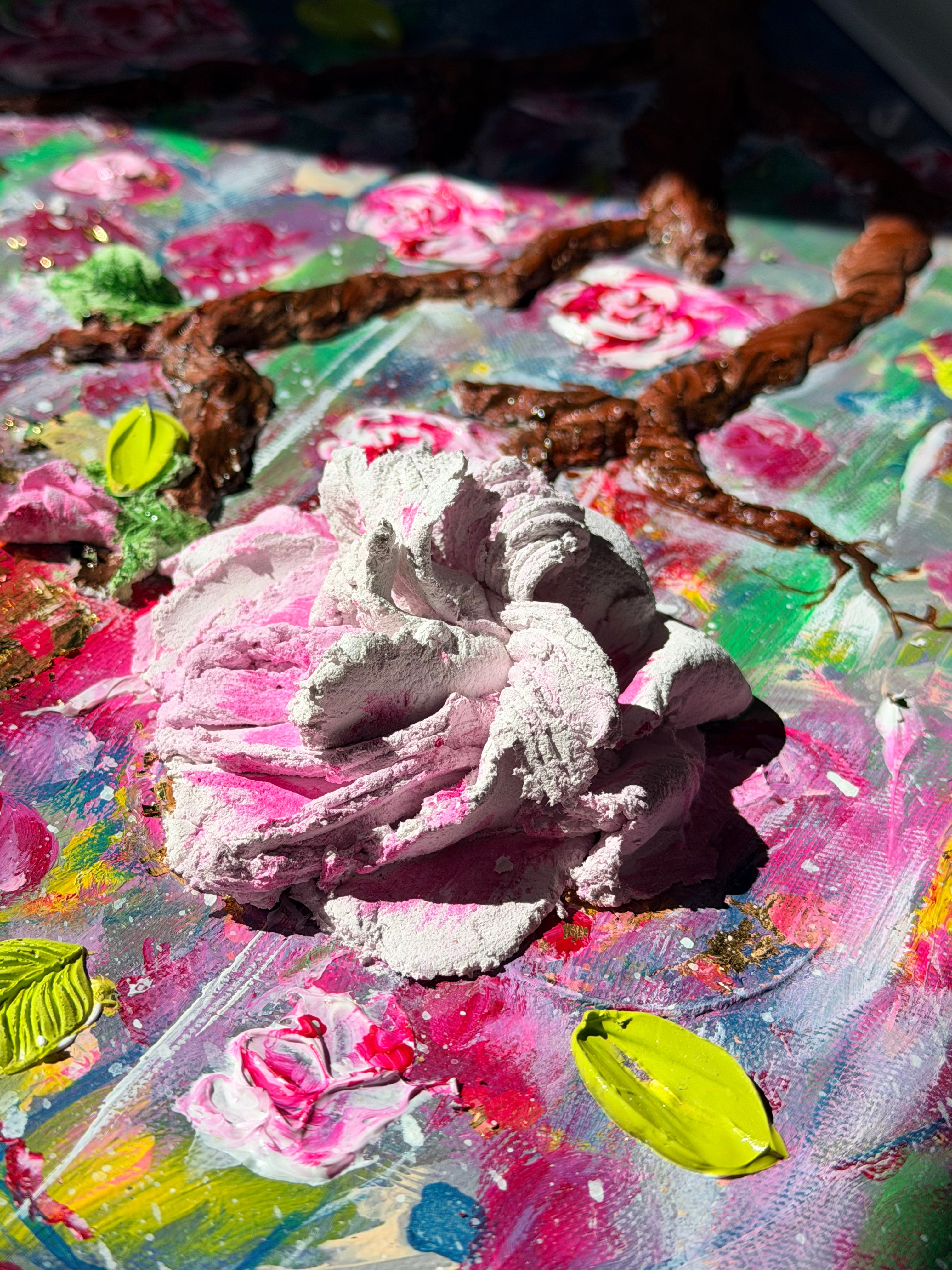Textured 3D canvas painting featuring a large pink rose with bright green leaves