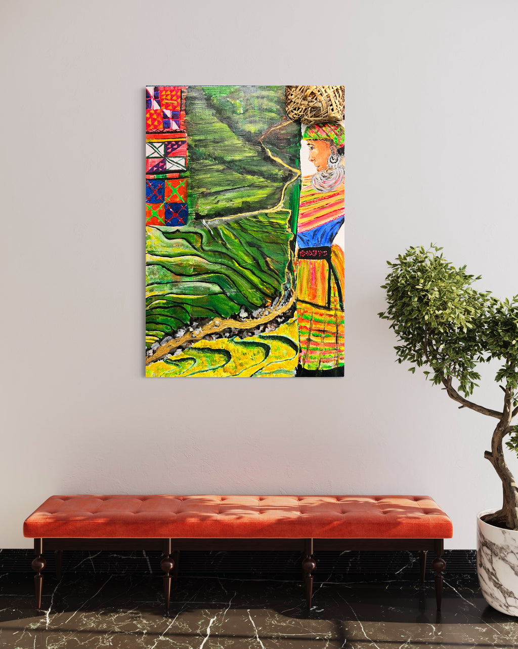 Framed wall art of green rice terraces with a colorful robed woman portrait.