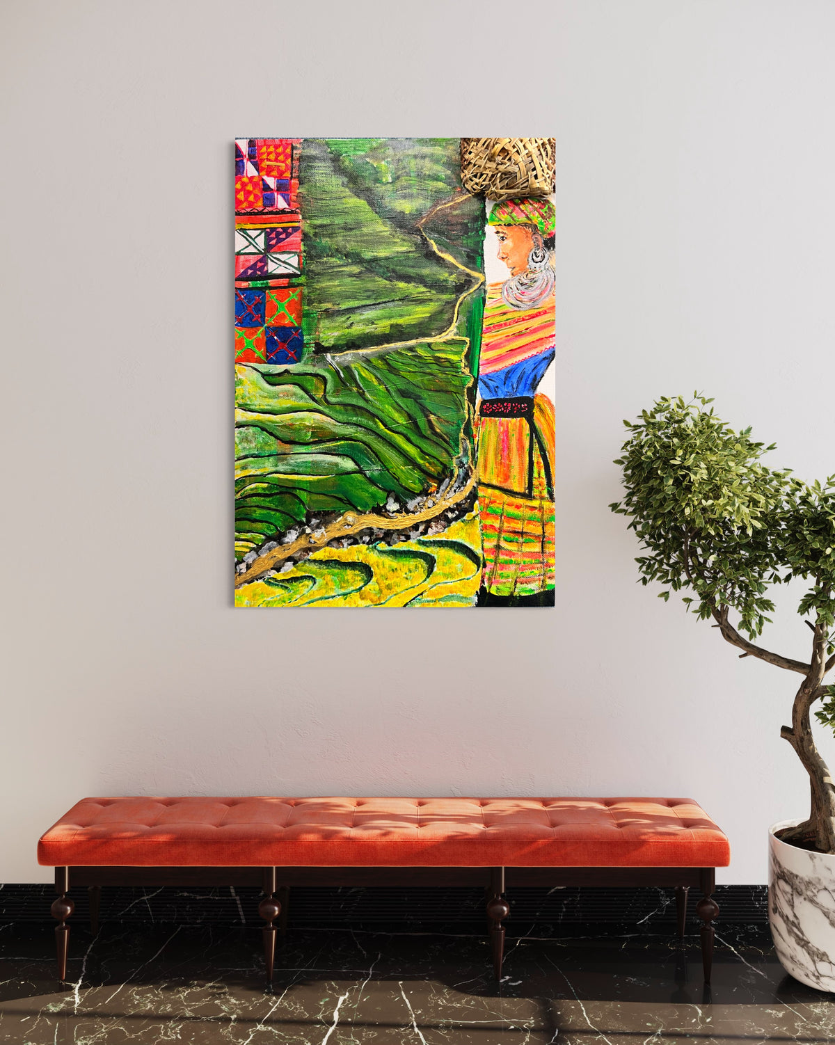 Framed wall art of green rice terraces with a colorful robed woman portrait.