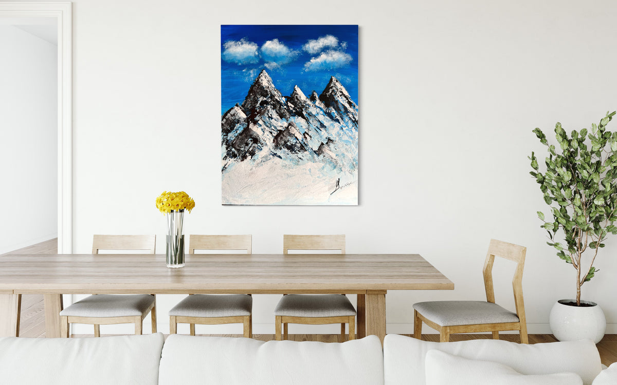 Mountain landscape wall art with bright blue sky, cloud textures, and snowy mountain peaks