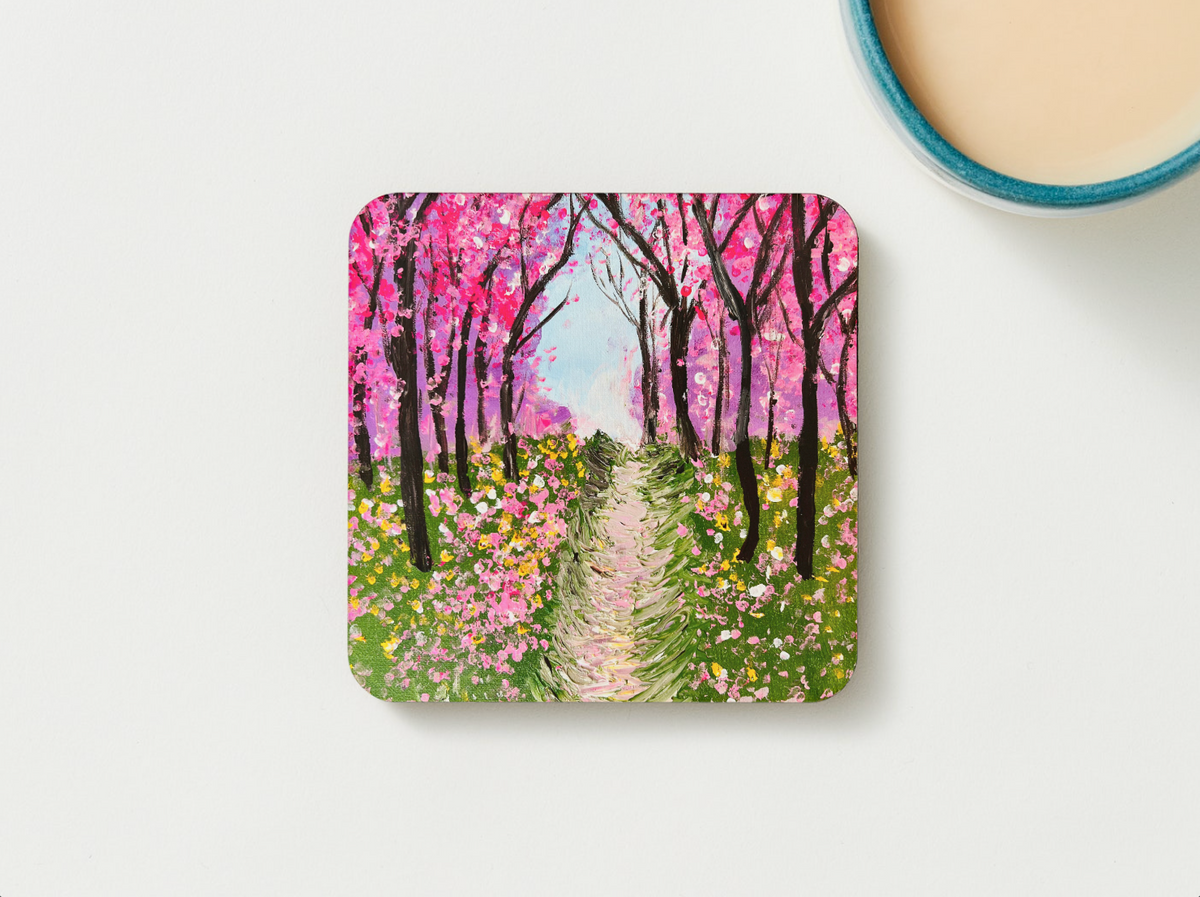 Square wooden coaster, front view, pink cherry blossom forest path painting design.