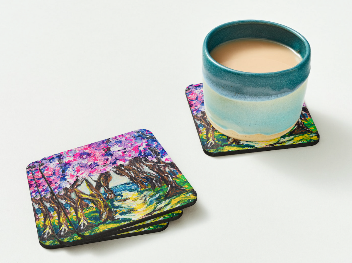 Glossy 9.5cm square hardboard coaster with a vibrant pink and purple floral acrylic painting, shown with a ceramic mug.