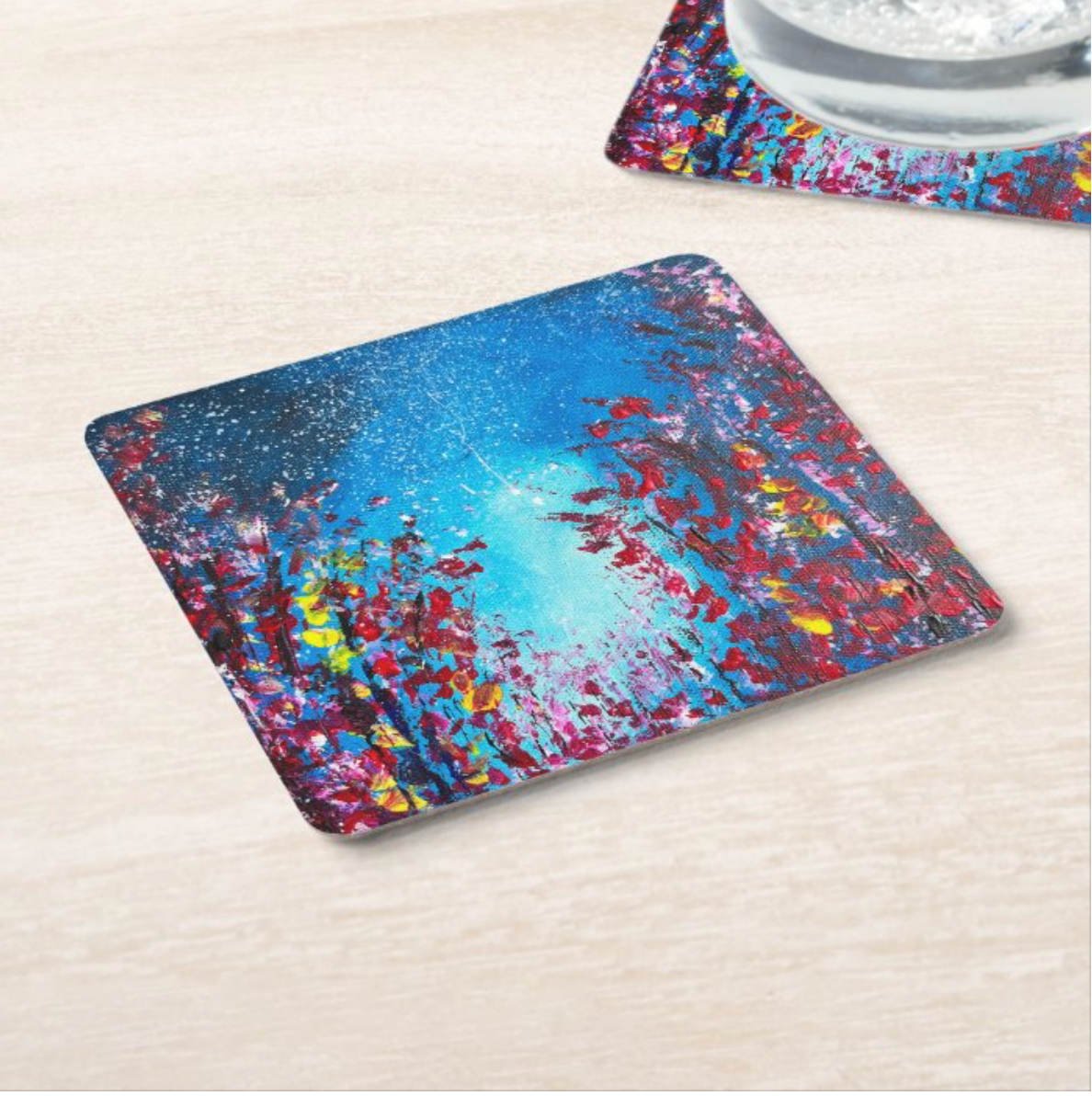 9.5cm square hardboard coaster with a glossy dark blue starry sky and vibrant floral acrylic painting design.