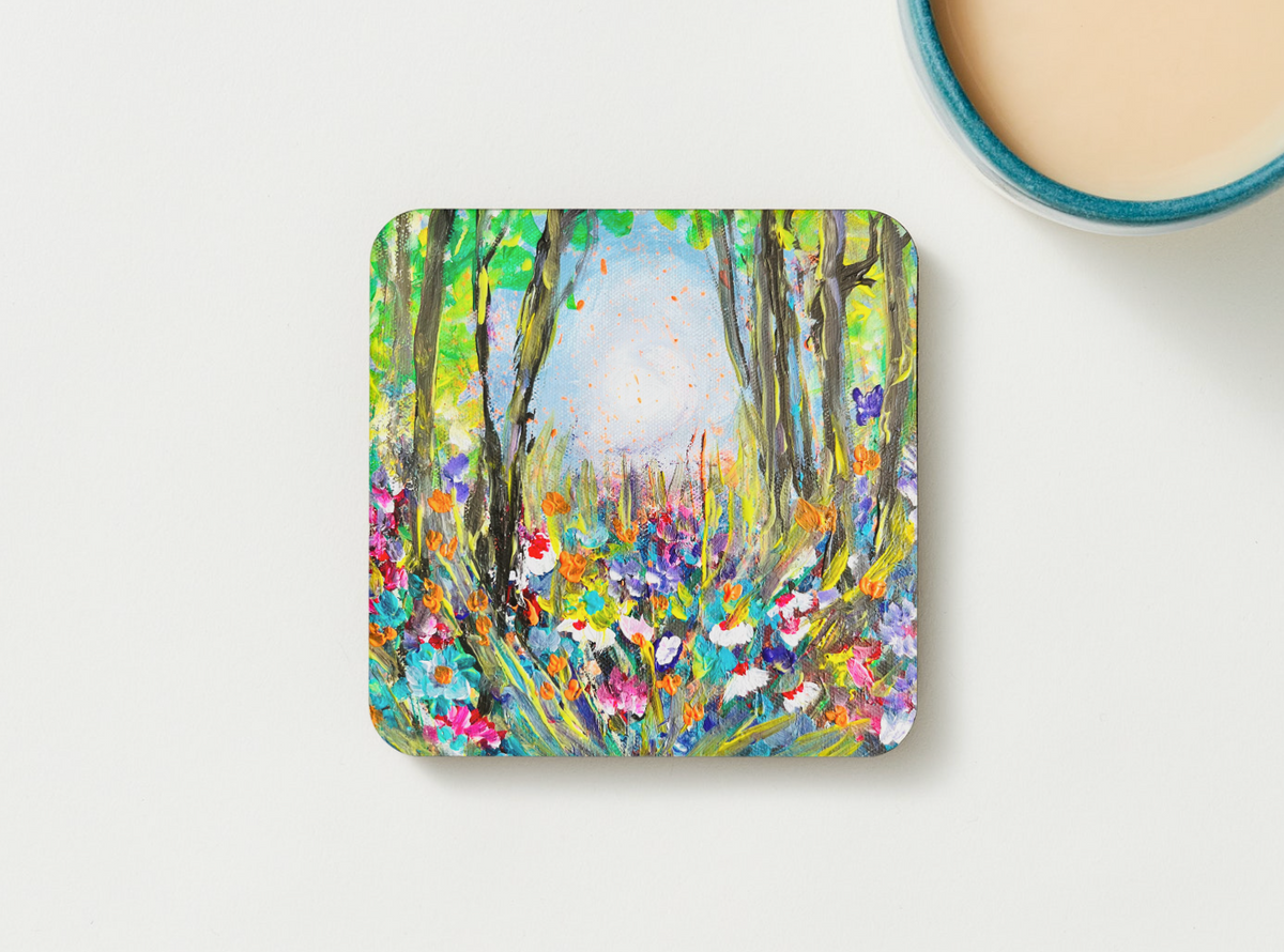 Square hardboard coaster with vibrant wildflower forest painting and rounded corners.