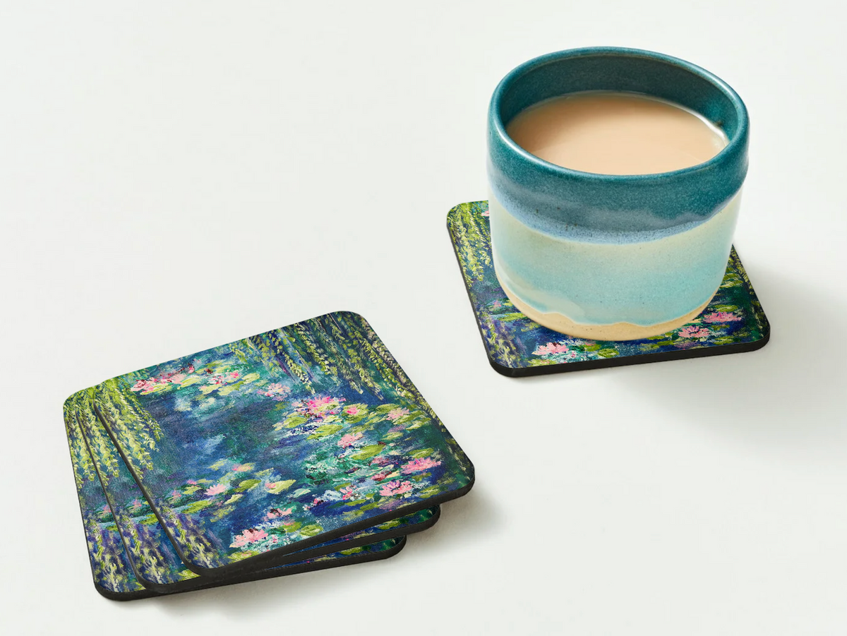 Glossy 9.5cm hardboard coasters featuring a vibrant Waterlily Pond acrylic painting, with a ceramic mug on one.