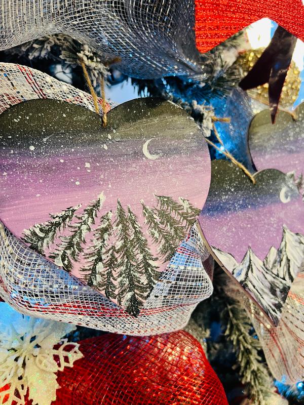 Hanging heart art decoration, heart ornament with crescent moon, purple sky, and pine forest