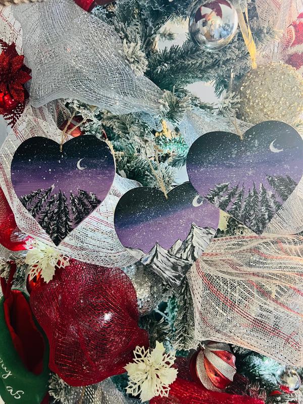 Hanging heart art decoration, multiple hearts with starry purple sky, crescent moon, and pine trees