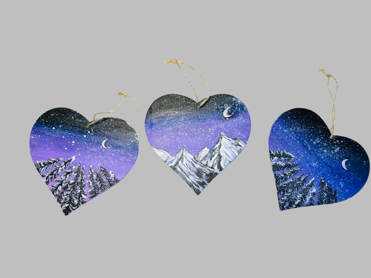 Hanging heart art decoration set of three, starry purple night sky with pine trees and mountains