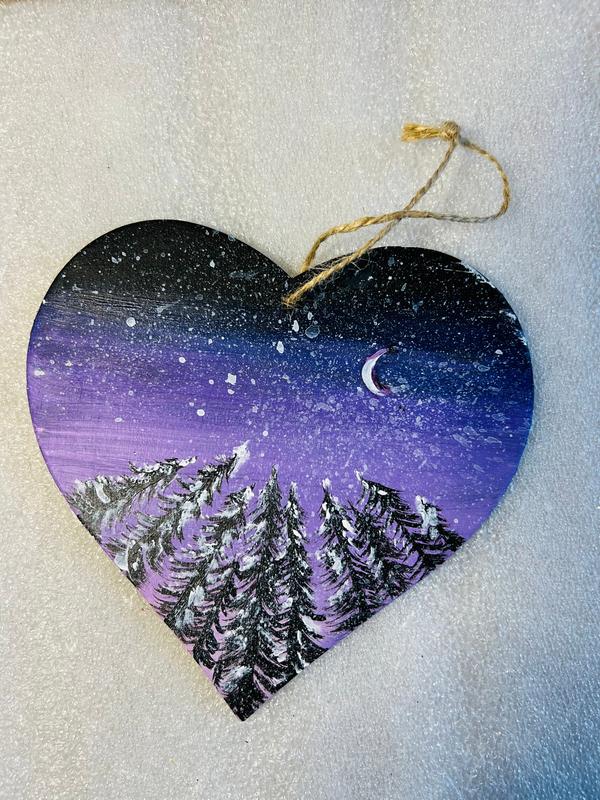 Hanging heart art decoration, purple night sky with crescent moon and pine forest below