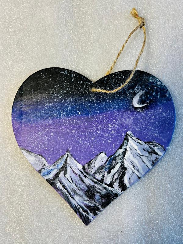 Hanging heart art decoration, dark blue and purple landscape with crescent moon and snowcapped peaks