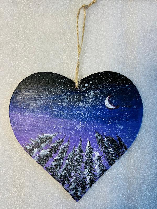 Hanging heart art decoration, blue and purple night sky with crescent moon, snowy mountains