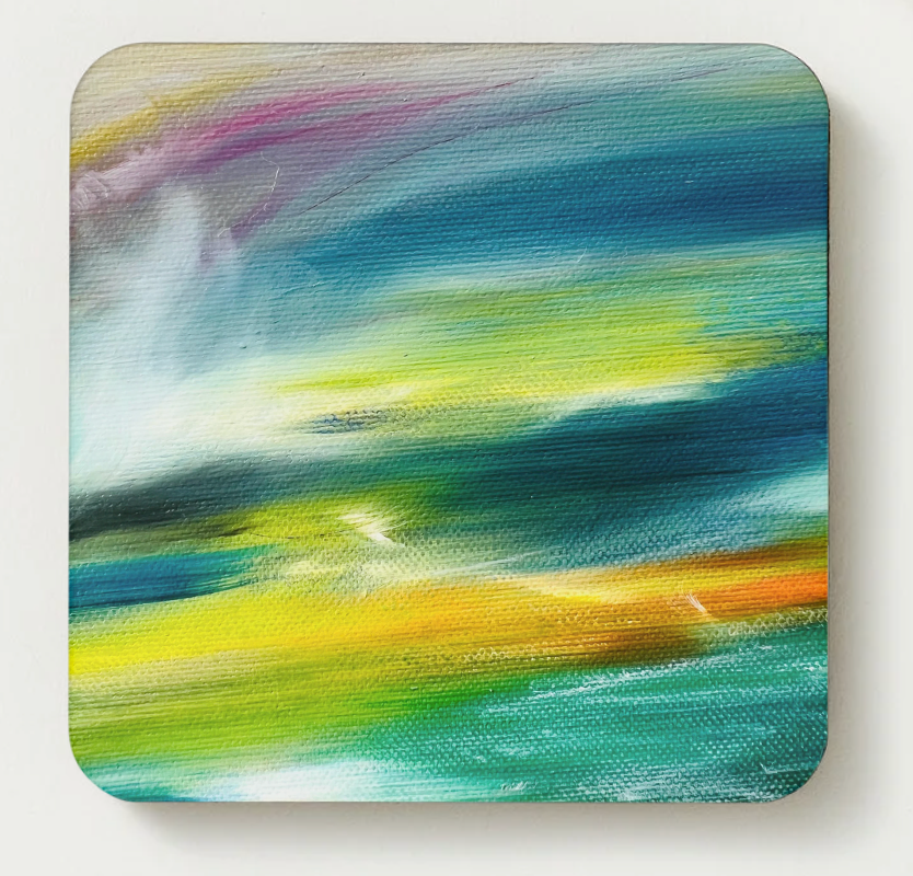 Hardboard coaster with green and blue coastal landscape artwork, square with rounded corners