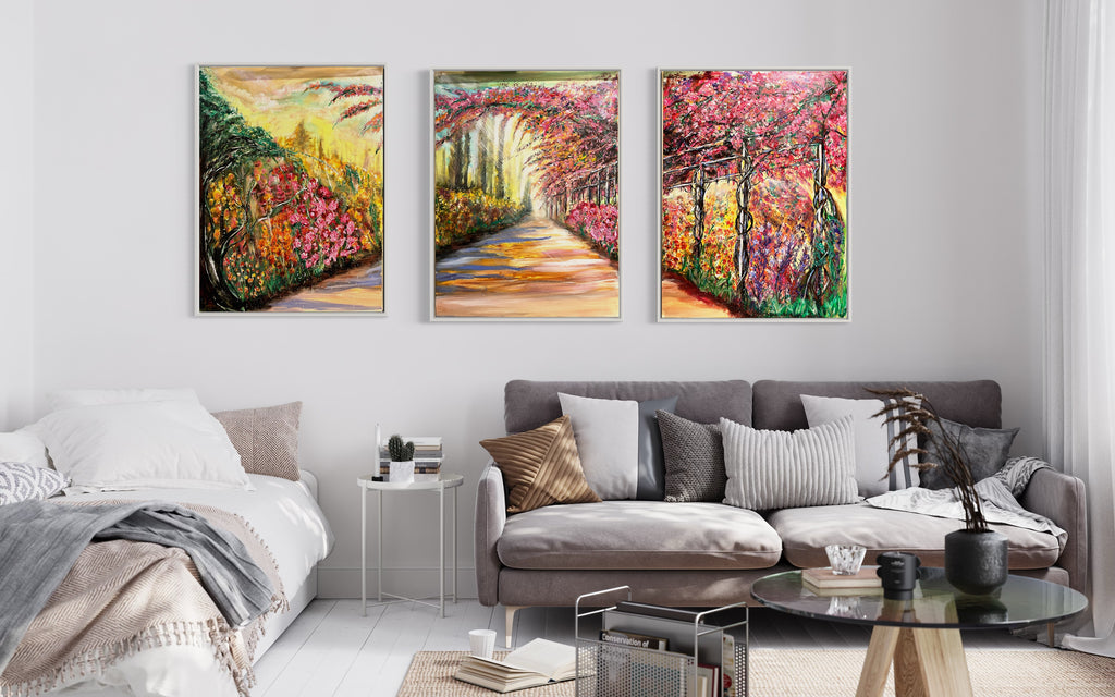 Set of three framed floral landscape wall prints with a bright walkway and vivid blossoms