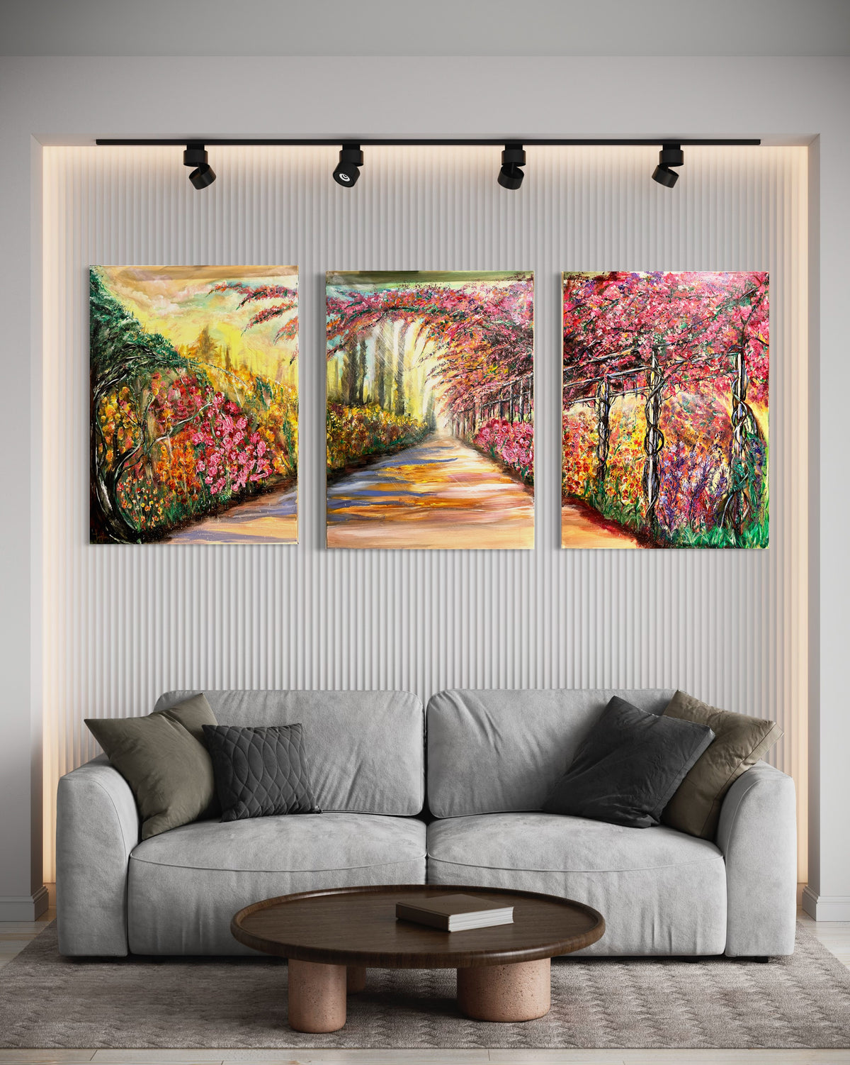 Three framed wall art prints above a sofa, showing a colorful blooming path scene