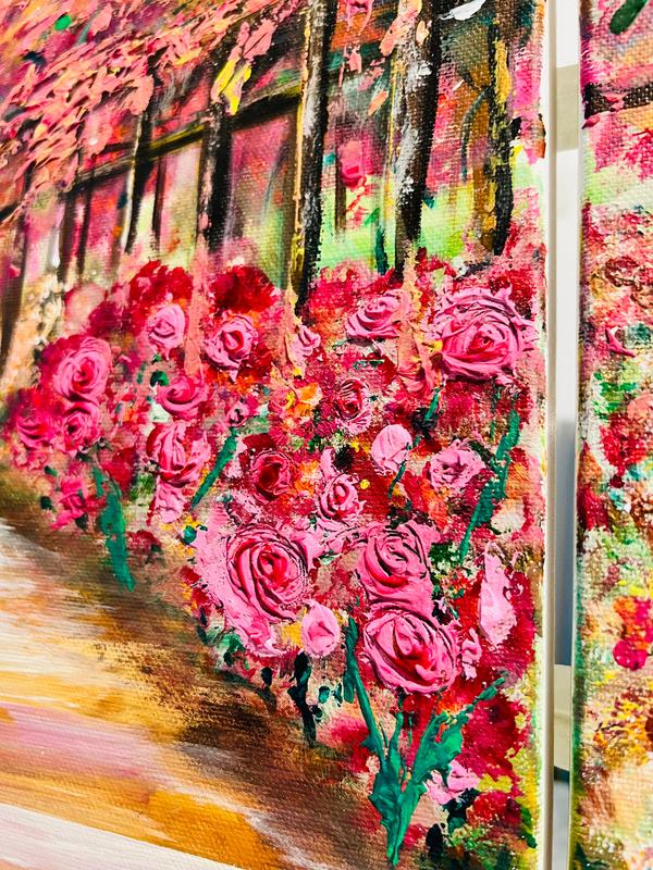 Close-up of a framed floral wall art print with dense pink and green blossoms and texture