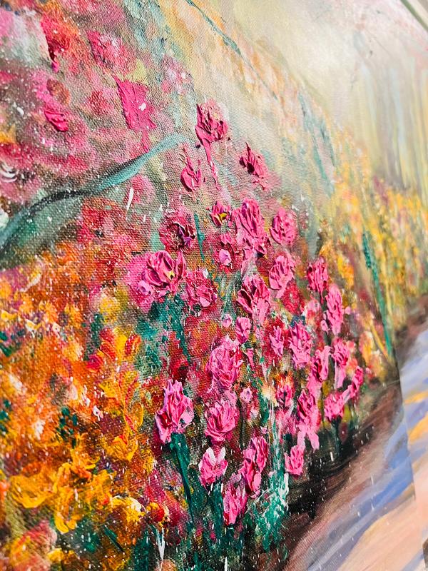 Close-up view of a floral wall art print showing layered pink roses and colorful brush texture