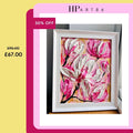 White-framed pink and white magnolia floral artwork, close-up