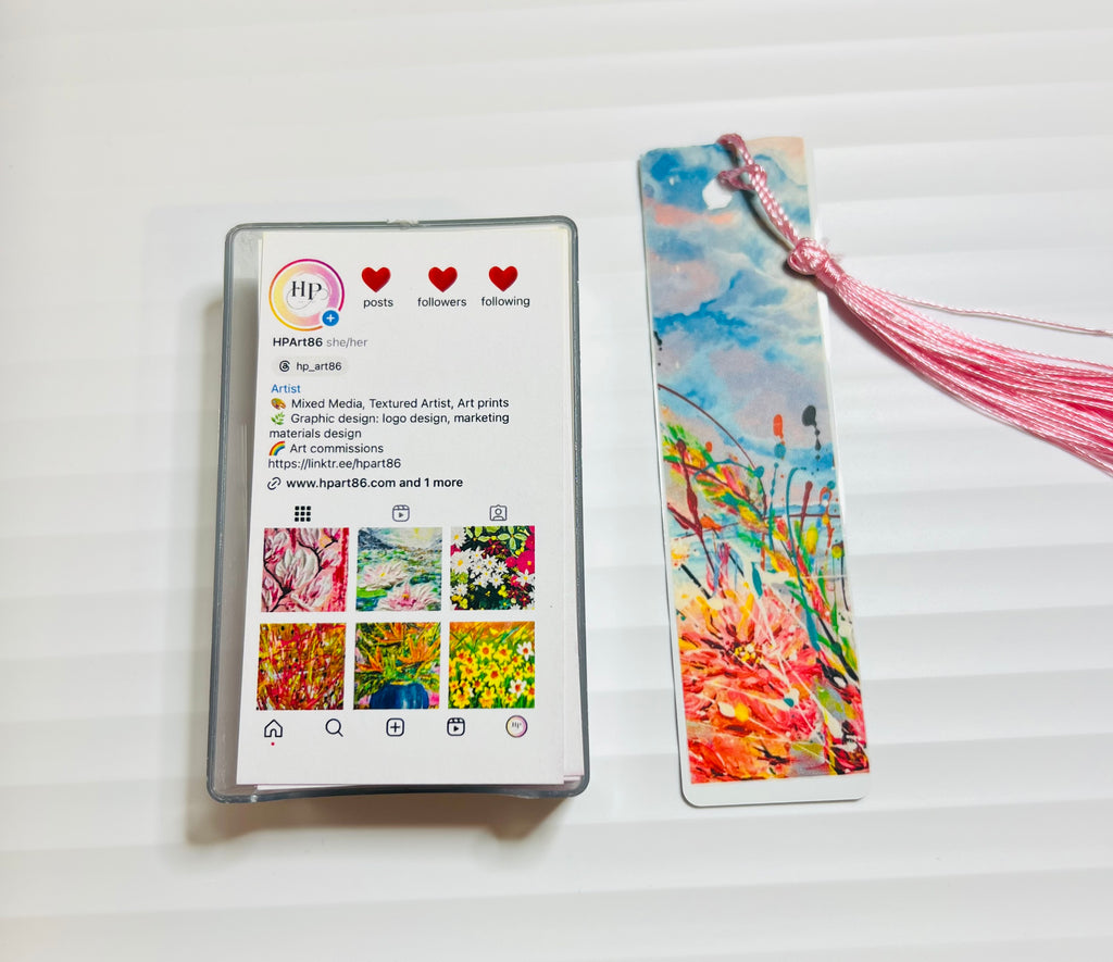 Metal bookmark with colorful floral watercolor design and pink tassel